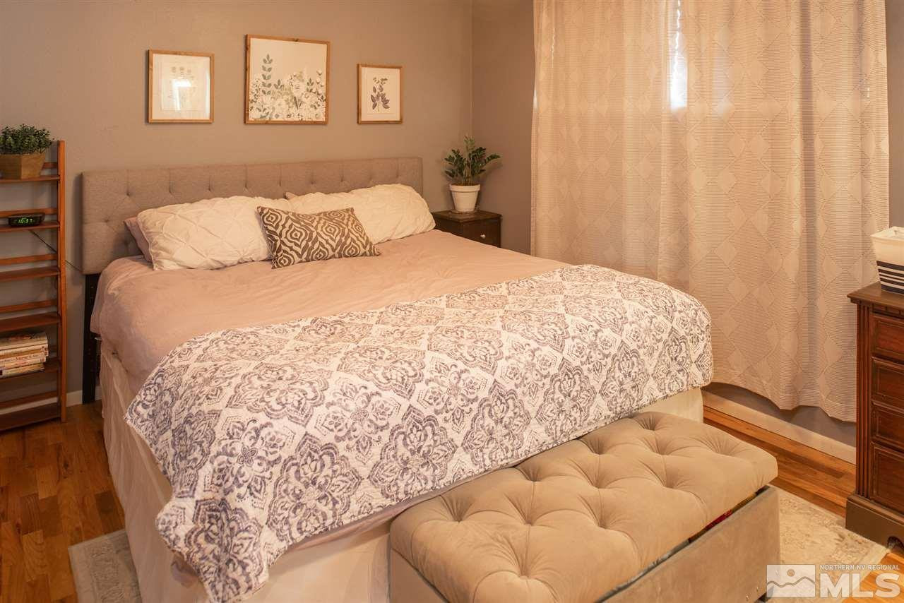 880 Beldon Way Reno, NV 89503 - Photo 8 of 20 a bedroom with a bed and a couch