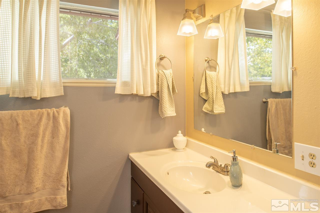 880 Beldon Way Reno, NV 89503 - Photo 10 of 20 a bathroom with a sink and a mirror