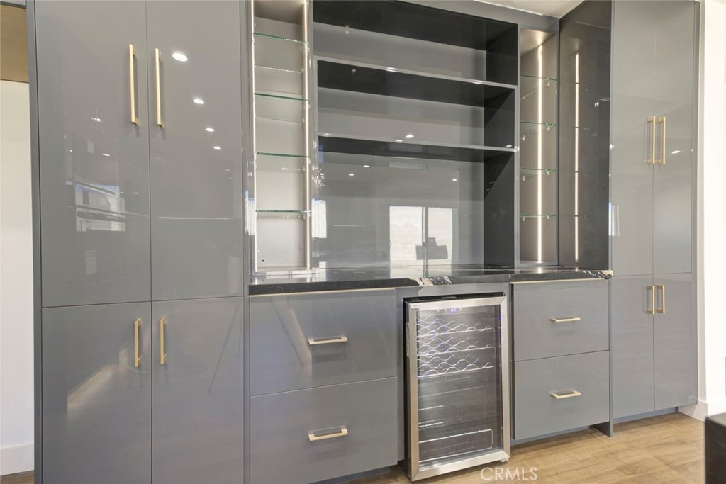 9055 Forbes Avenue Northridge, CA 91343 - Photo 14 of 62 a bathroom with a granite countertop sink mirror and shower