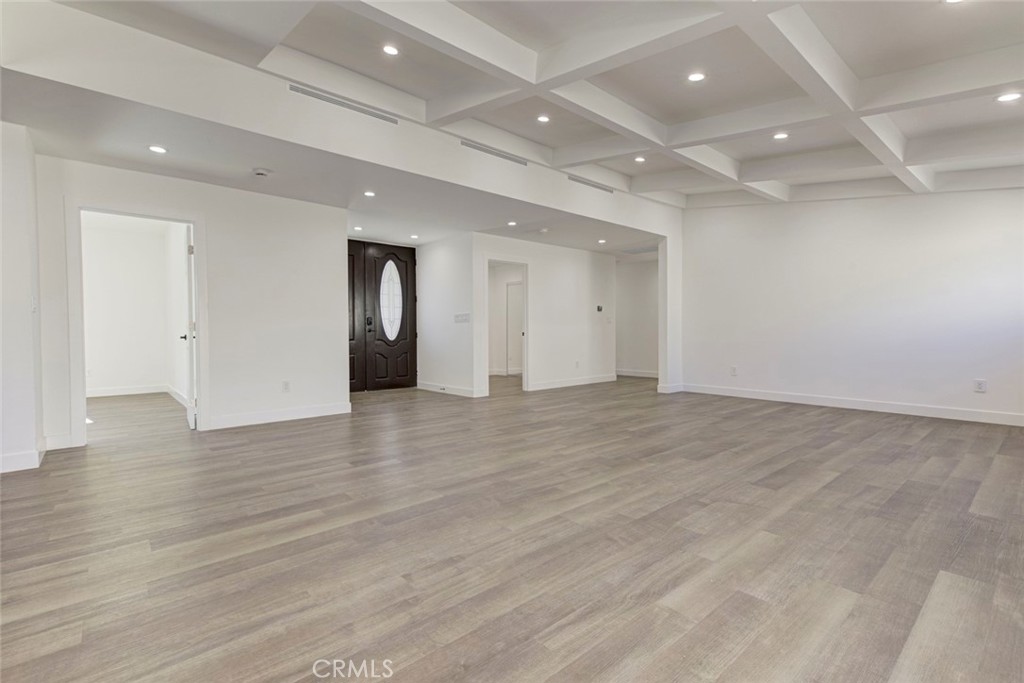 9055 Forbes Avenue Northridge, CA 91343 - Photo 19 of 62 an empty room with wooden floor and bathroom