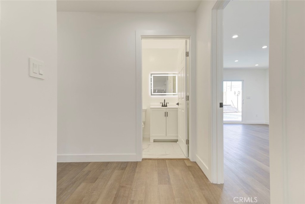 9055 Forbes Avenue Northridge, CA 91343 - Photo 25 of 62 a view of a hallway with wooden floor