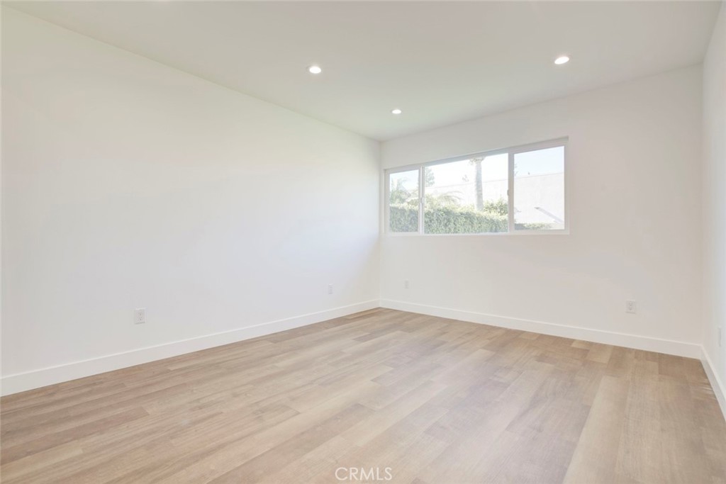 9055 Forbes Avenue Northridge, CA 91343 - Photo 37 of 62 an empty room with wooden floor and windows