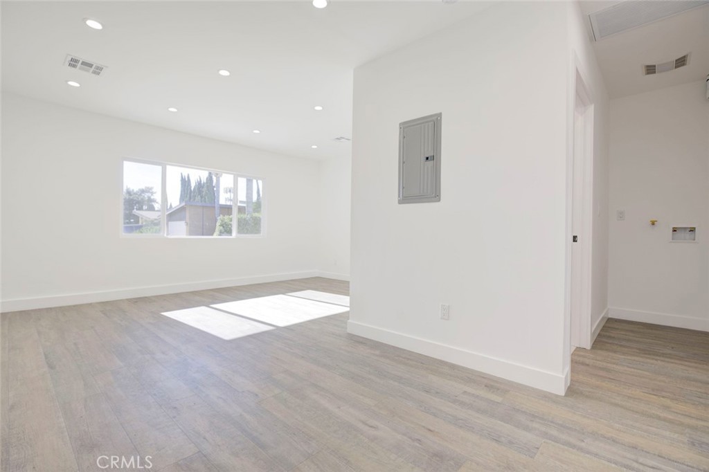 9055 Forbes Avenue Northridge, CA 91343 - Photo 52 of 62 an empty room with wooden floor and windows