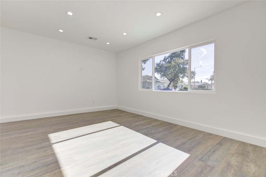 9055 Forbes Avenue Northridge, CA 91343 - Photo 55 of 62 an empty room with wooden floor and window