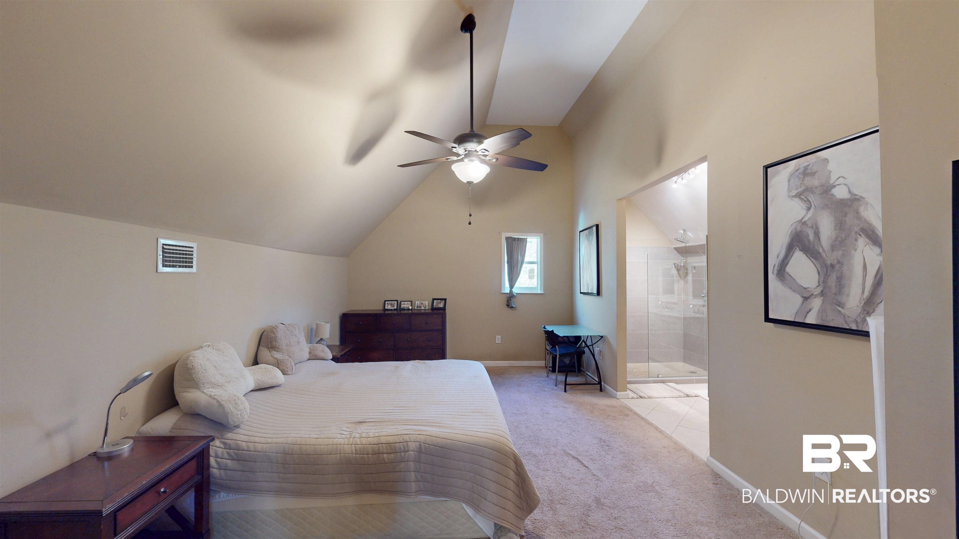 1154 New St Francis Street Mobile, AL 36604 - Photo 32 of 37 Bedroom featuring visible vents, baseboards, vaulted ceiling, ensuite bathroom, and light colored carpet