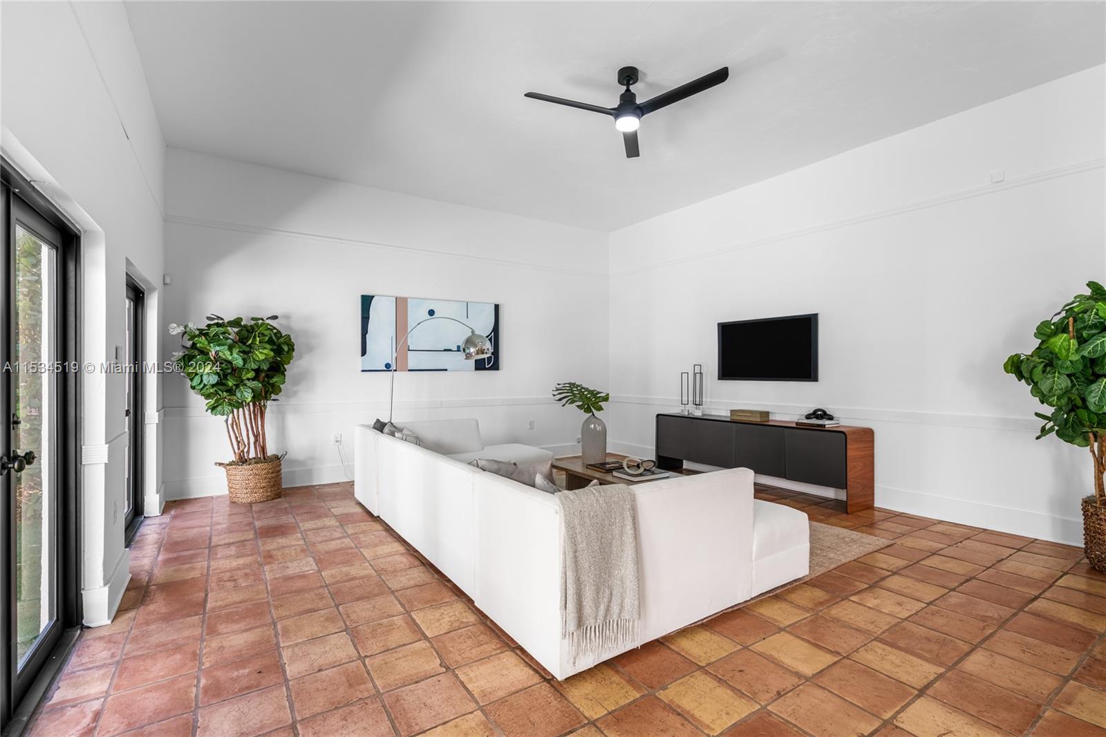 3871 South Le Jeune Road Miami, FL 33146 - Photo 12 of 49 a living room with furniture and a flat screen tv