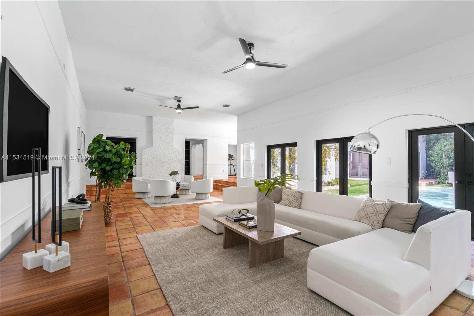 3871 South Le Jeune Road Miami, FL 33146 - Photo 13 of 49 a living room with furniture and a flat screen tv