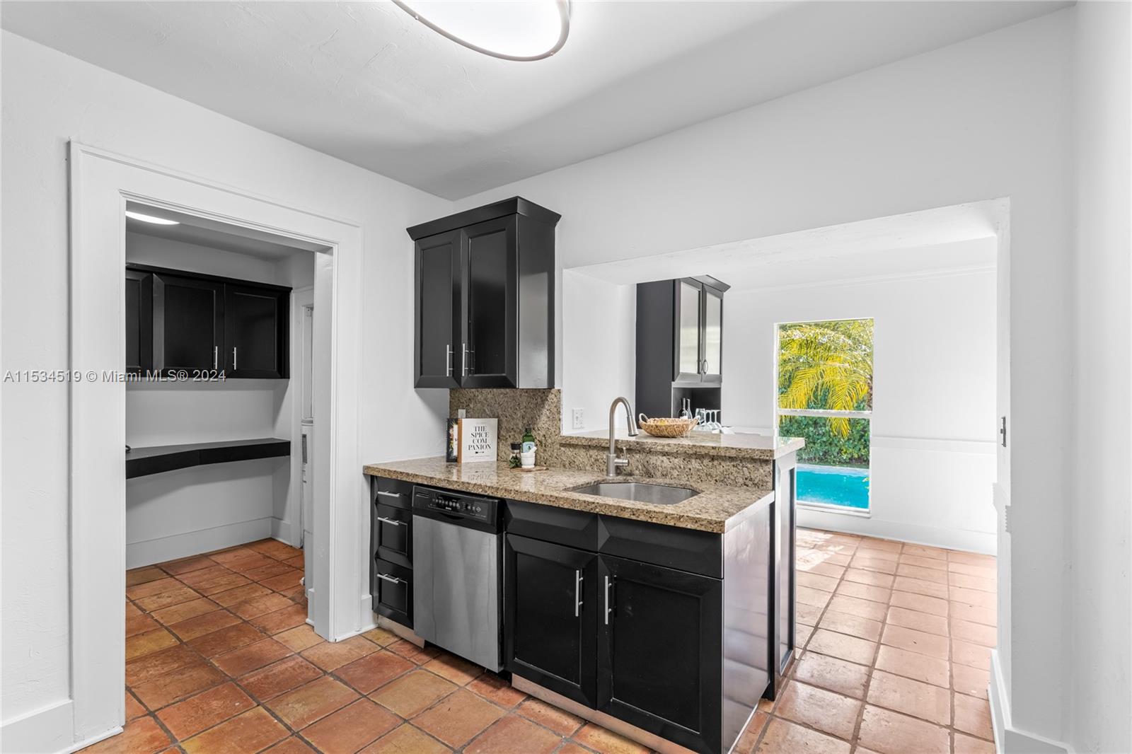 3871 South Le Jeune Road Miami, FL 33146 - Photo 16 of 49 a view of a bathroom with a sink and mirror