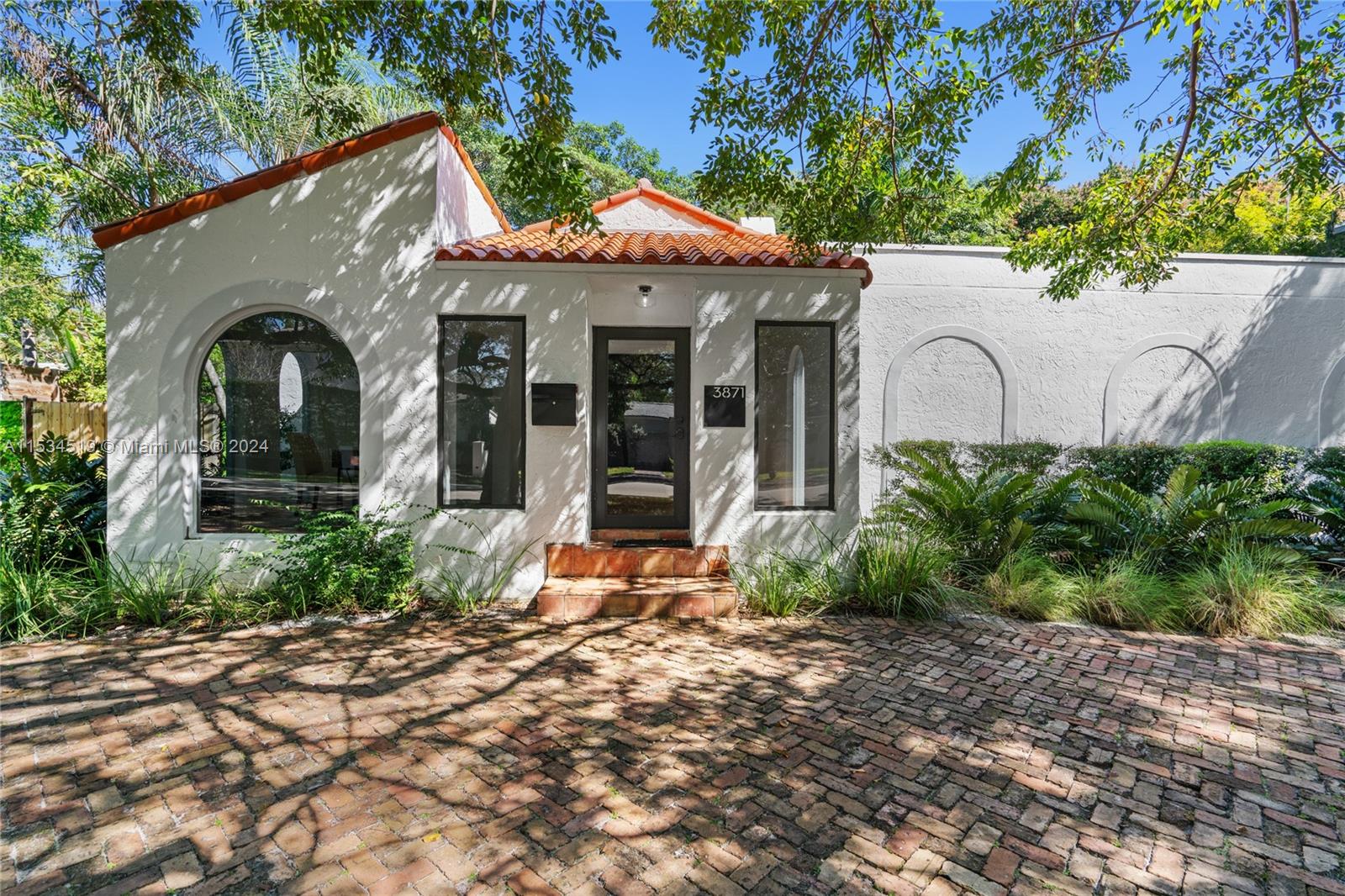 3871 South Le Jeune Road Miami, FL 33146 - Photo 2 of 49 a front view of a house with garden