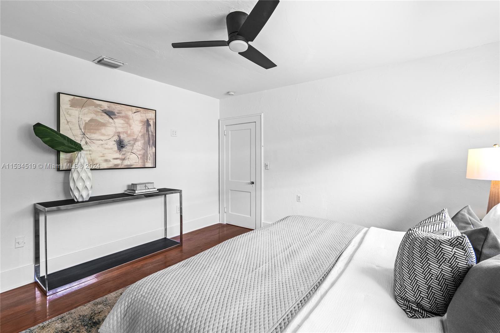 3871 South Le Jeune Road Miami, FL 33146 - Photo 23 of 49 a bedroom with a bed and a chandelier