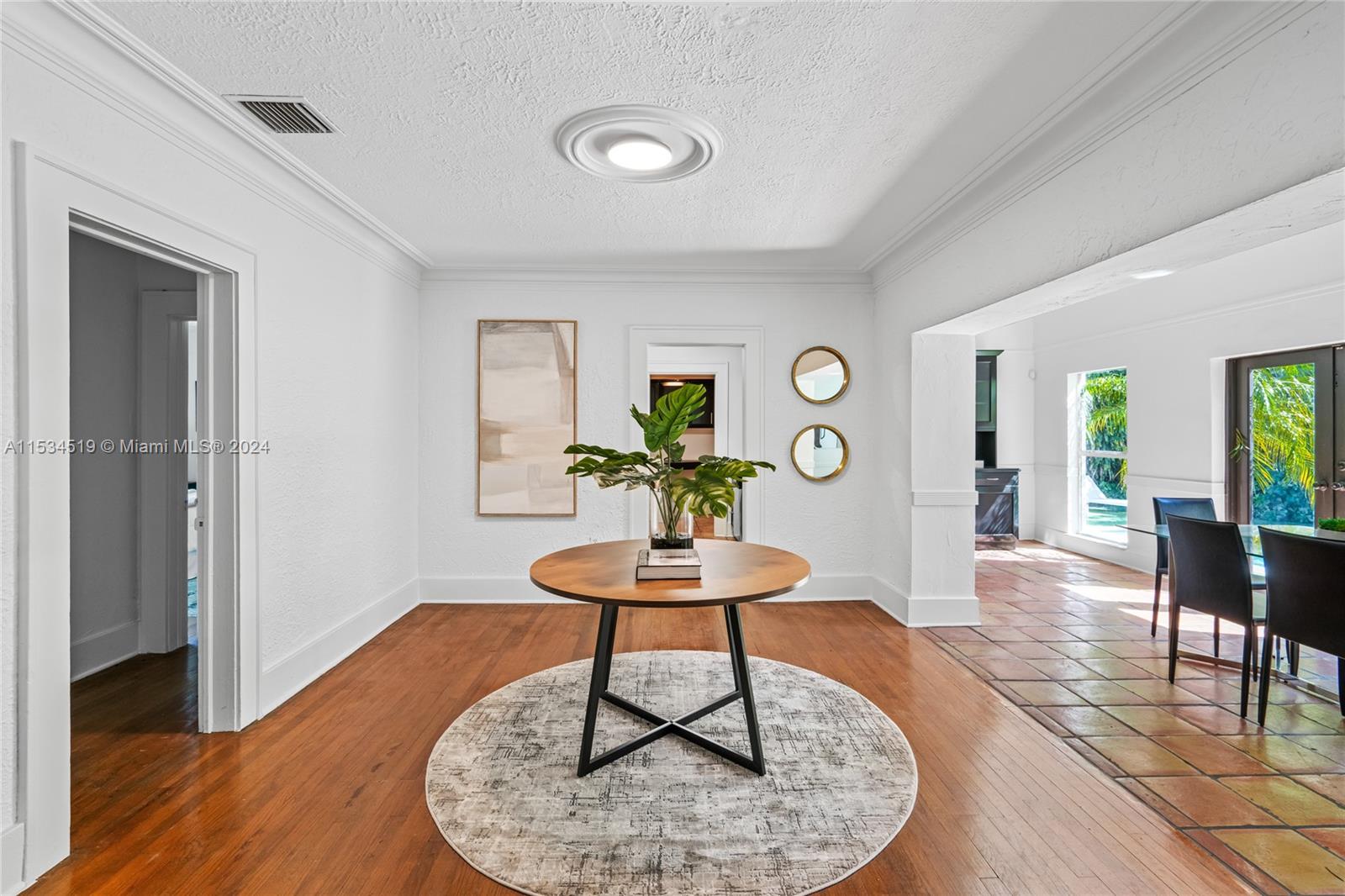 3871 South Le Jeune Road Miami, FL 33146 - Photo 26 of 49 a living room with furniture and wooden floor