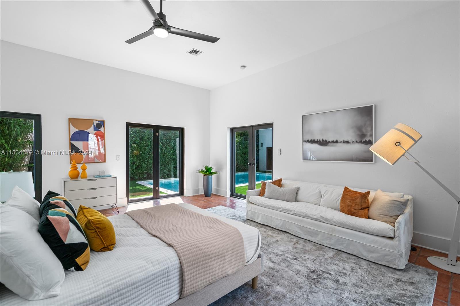 3871 South Le Jeune Road Miami, FL 33146 - Photo 28 of 49 a bedroom with a bed couch and window