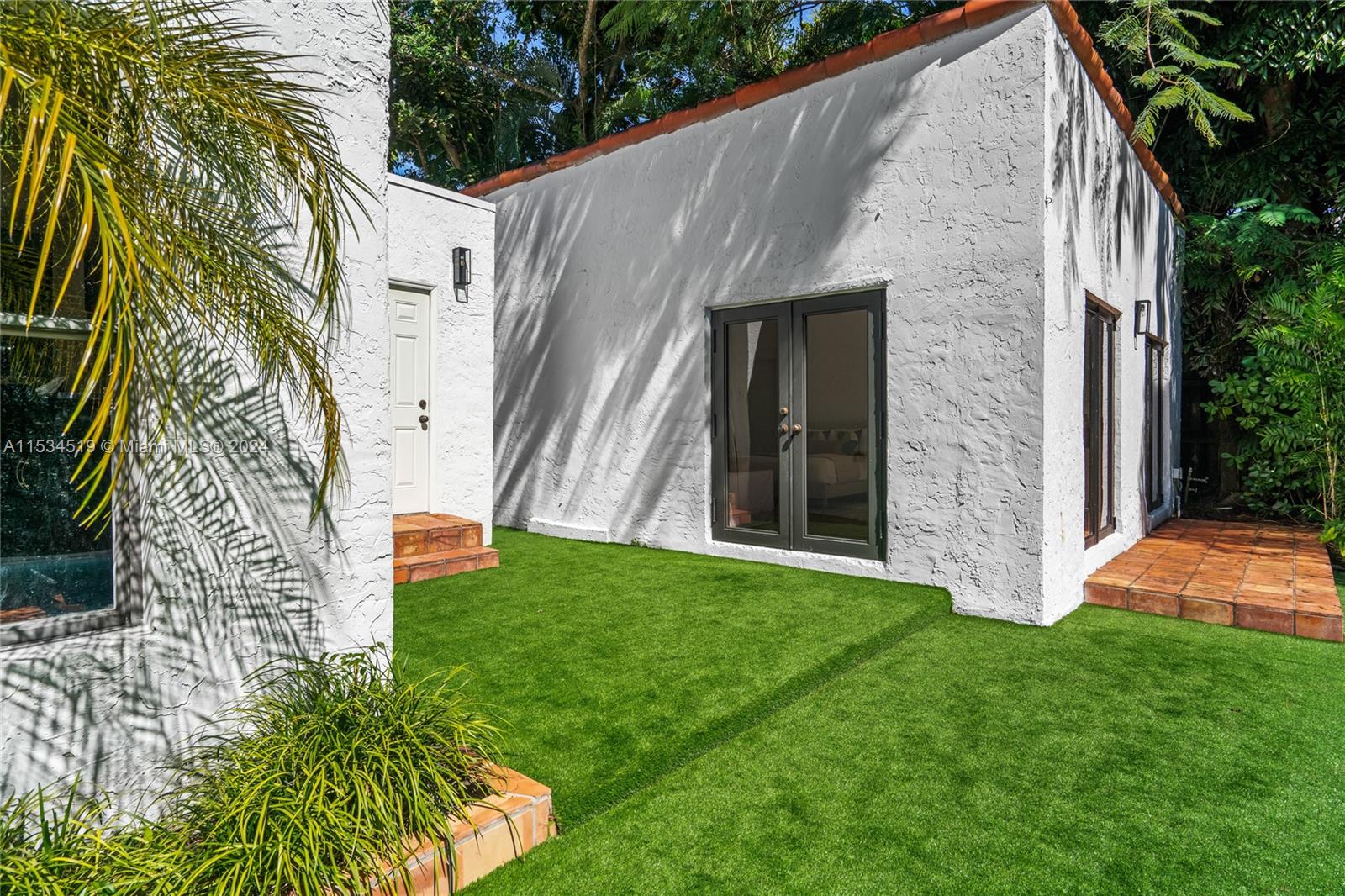 3871 South Le Jeune Road Miami, FL 33146 - Photo 35 of 49 a backyard of a house with seating space