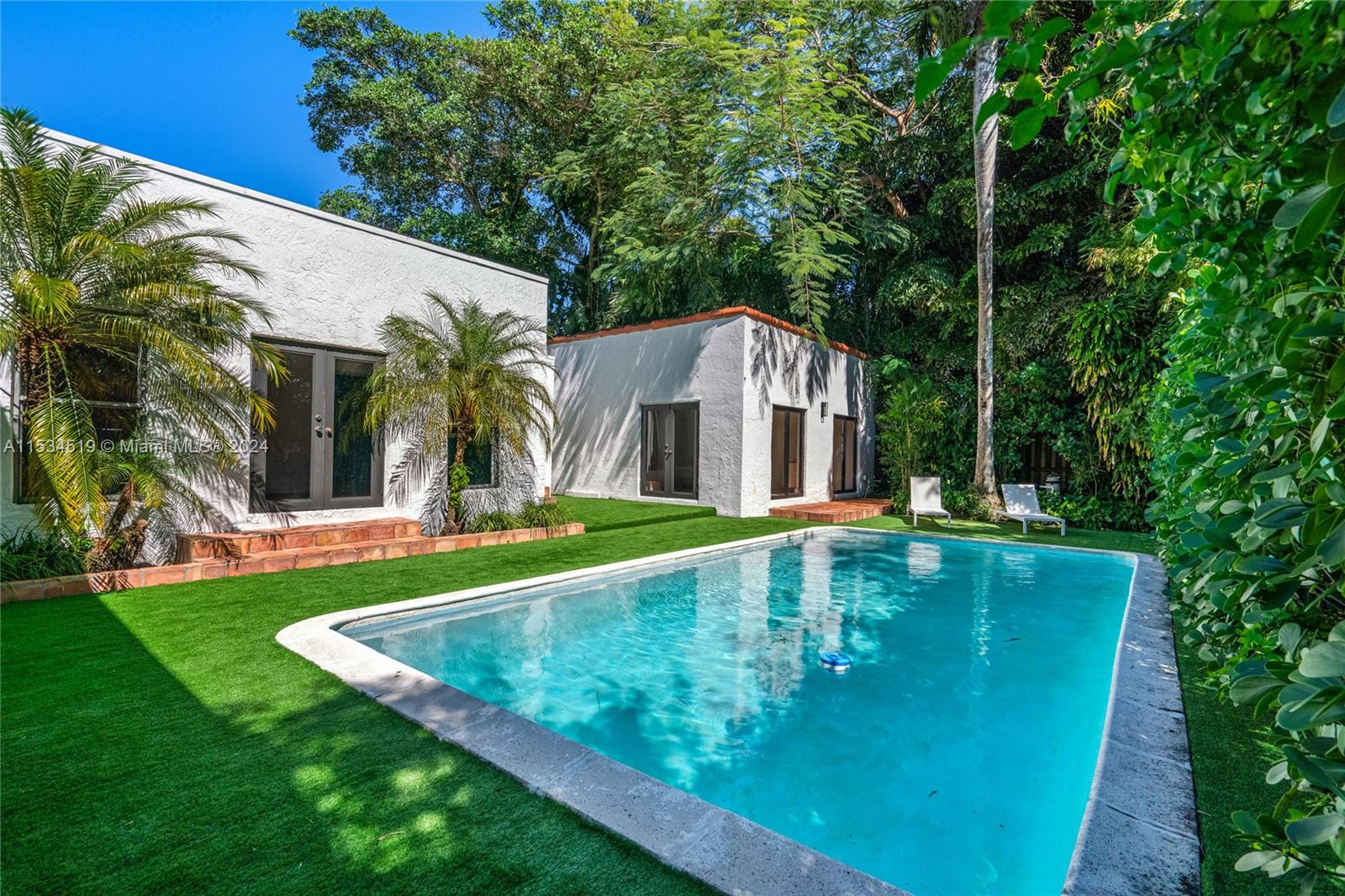 3871 South Le Jeune Road Miami, FL 33146 - Photo 40 of 49 swimming pool view with a outdoor seating