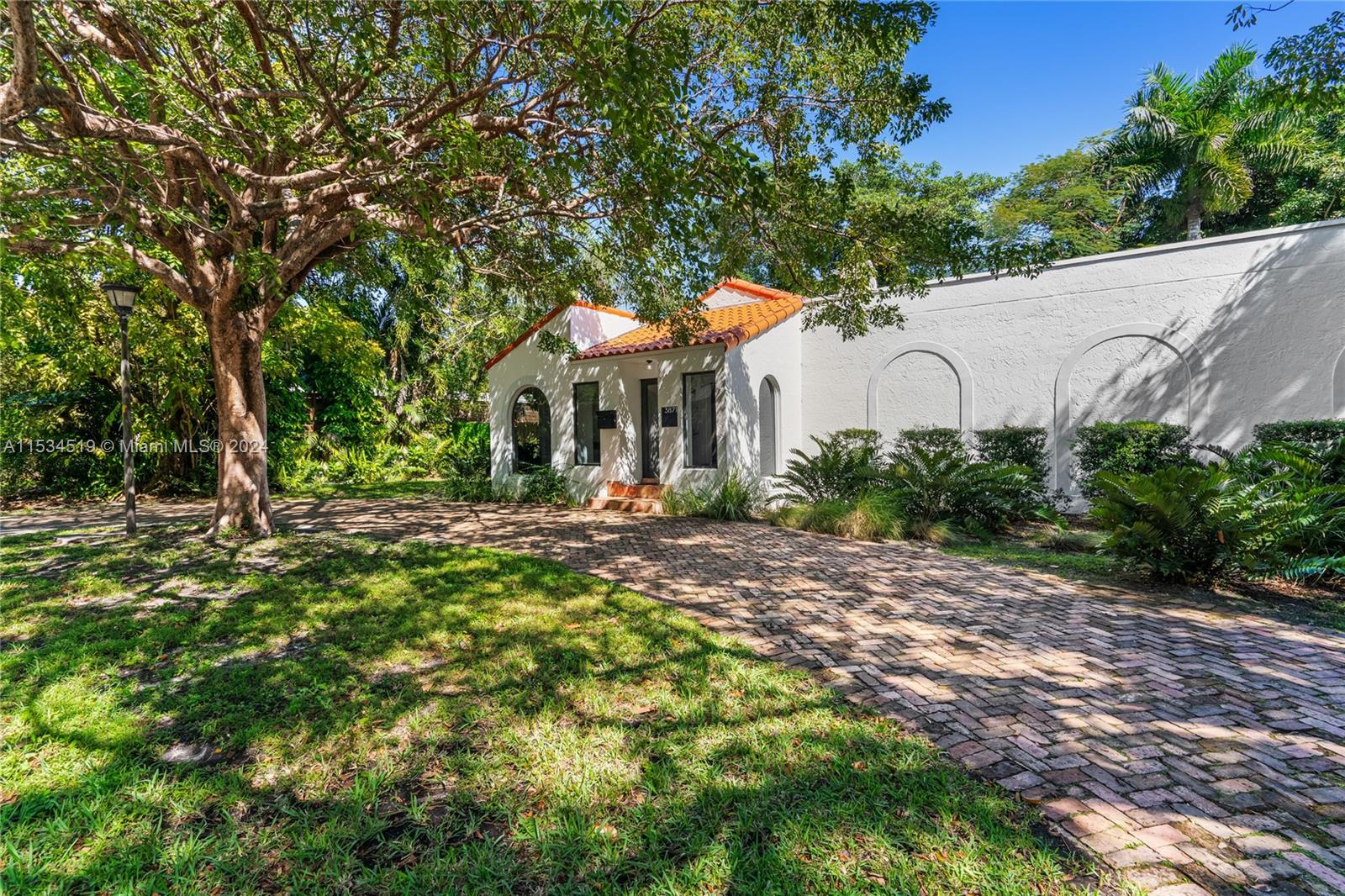 3871 South Le Jeune Road Miami, FL 33146 - Photo 4 of 49 a front view of a house with a yard