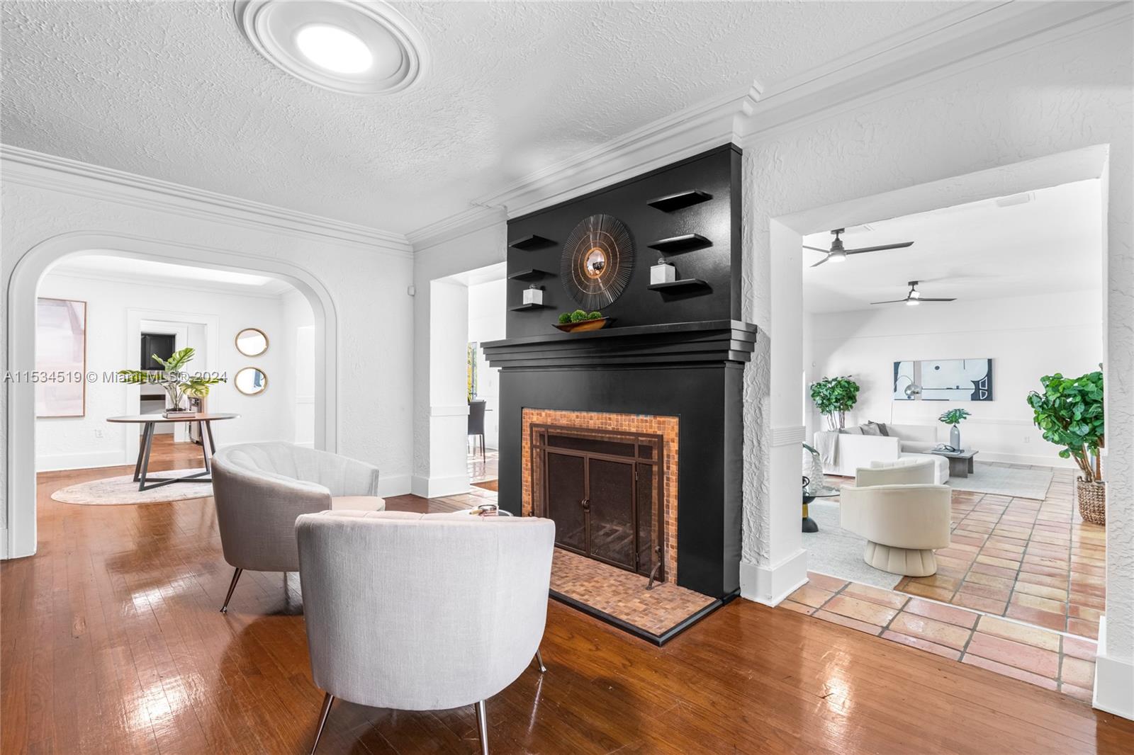 3871 South Le Jeune Road Miami, FL 33146 - Photo 6 of 49 a living room with furniture and a fireplace
