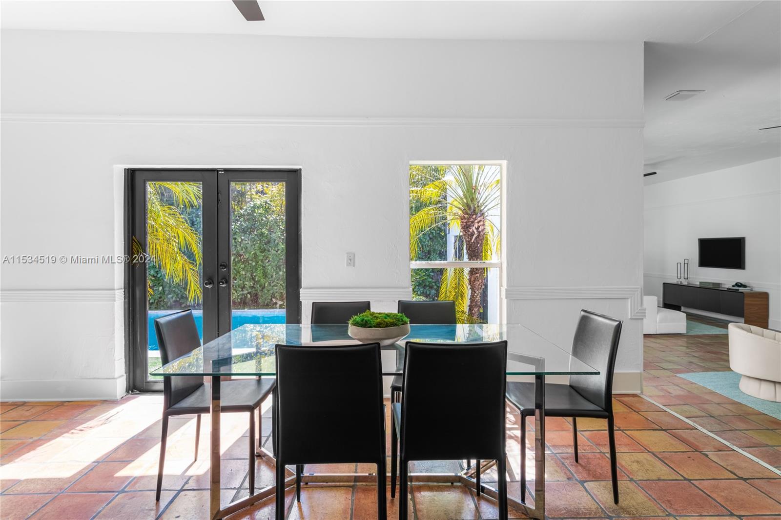 3871 South Le Jeune Road Miami, FL 33146 - Photo 9 of 49 a view of a dining room with furniture a rug and wooden floor