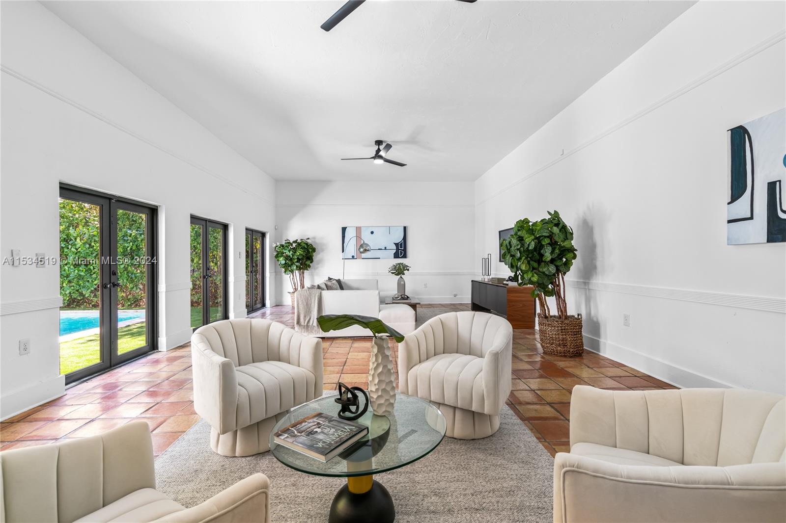 3871 South Le Jeune Road Miami, FL 33146 - Photo 10 of 49 a living room with furniture potted plant and a large window