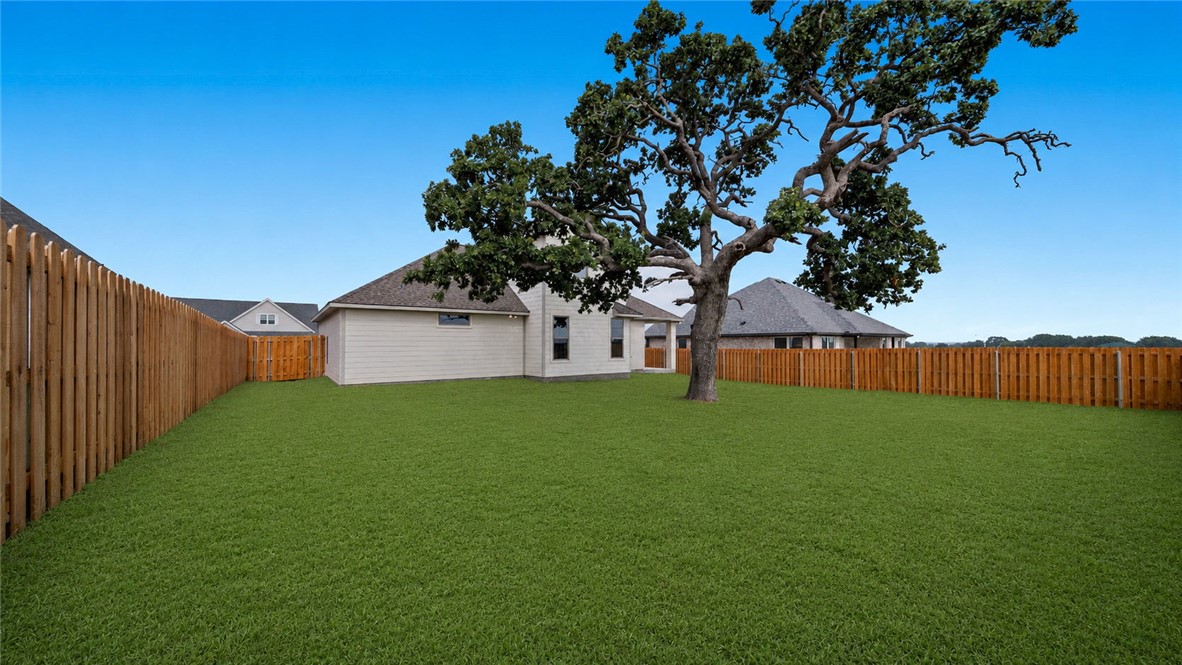 162 Buffalo Rdg Road Giddings, TX 78942 - Photo 29 of 31 a backyard of a house with lots of green space
