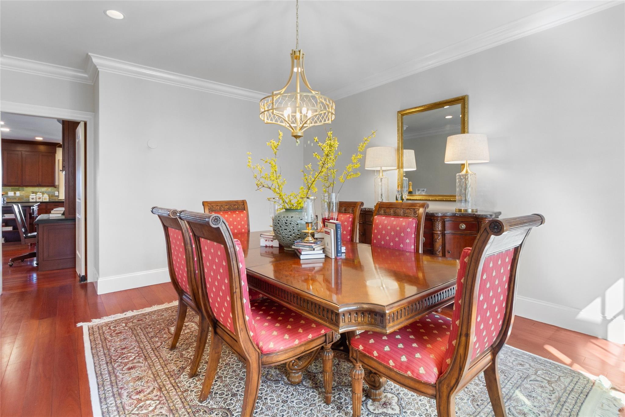 24 Country Club Lane Briarcliff Manor, NY 10510 - Photo 13 of 42 a dining room with furniture a chandelier and wooden floor