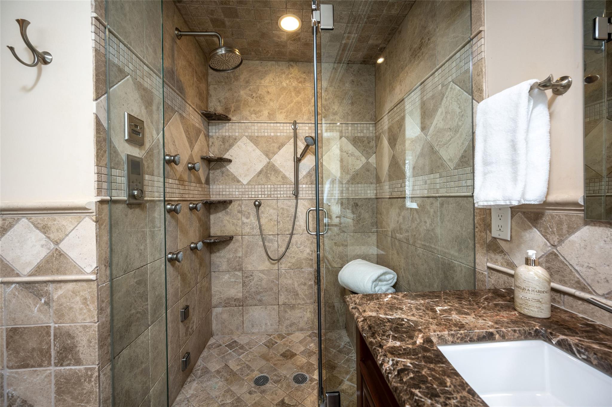 24 Country Club Lane Briarcliff Manor, NY 10510 - Photo 20 of 42 a bathroom with a granite countertop shower and a sink
