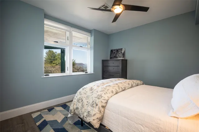 a bedroom with bed and window