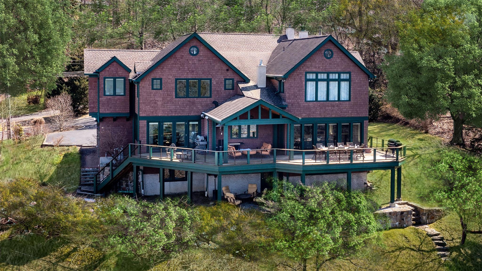 24 Country Club Lane Briarcliff Manor, NY 10510 - Photo 36 of 42 a front view of a house with yard and green space