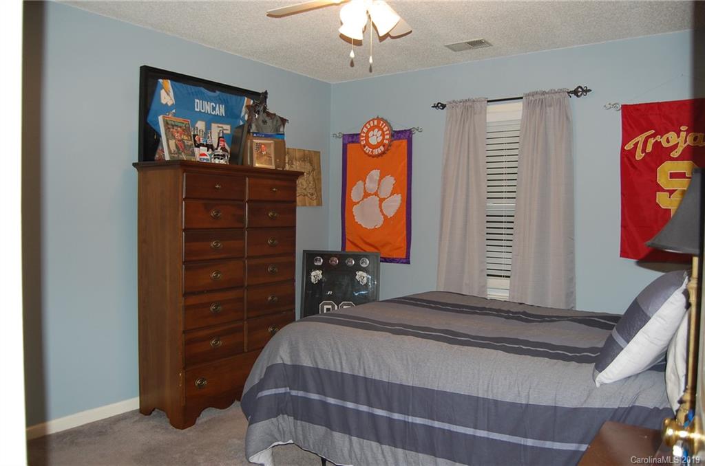 4385 Rimer Road Concord, NC 28025 - Photo 22 of 34 a bedroom with a bed and a television