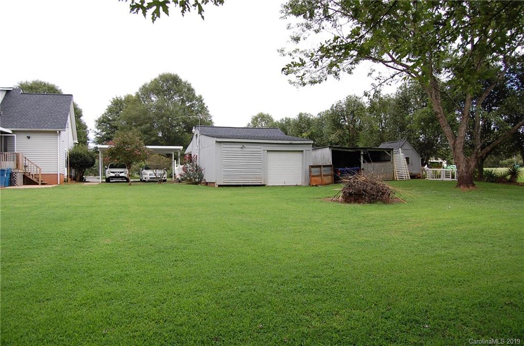 4385 Rimer Road Concord, NC 28025 - Photo 4 of 34 a view of a house with a yard and sitting area