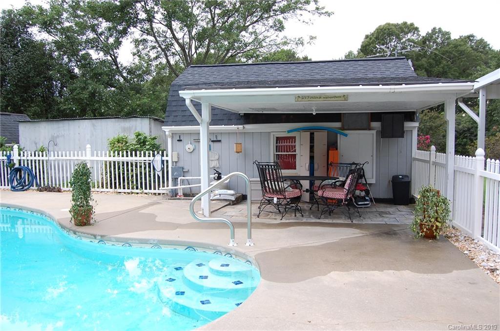 4385 Rimer Road Concord, NC 28025 - Photo 34 of 34 a view of a patio with table and chairs with wooden fence