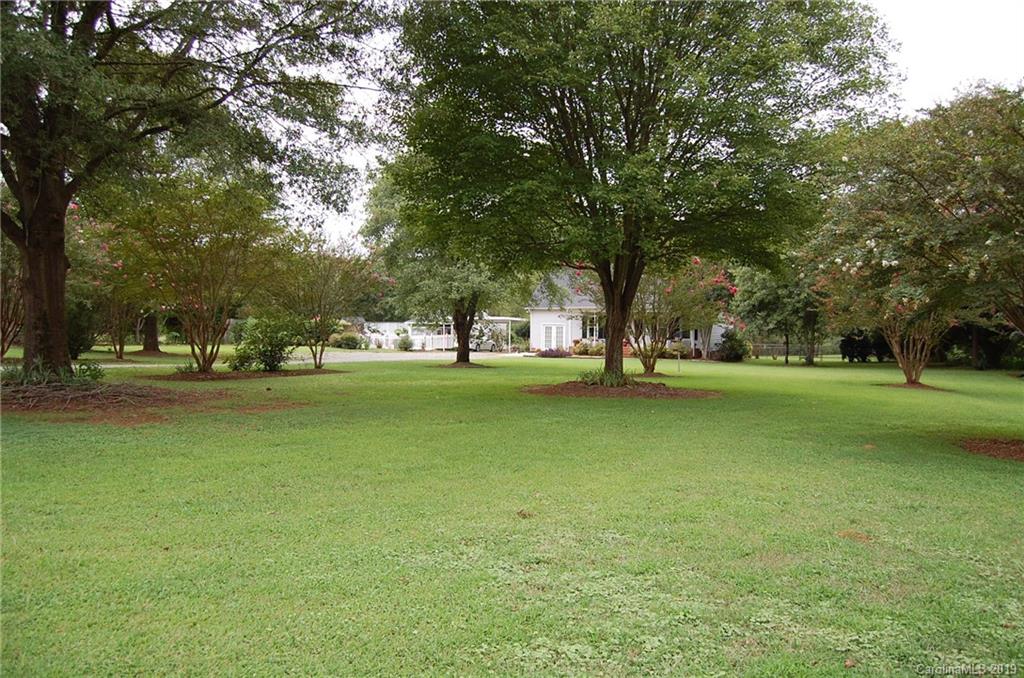 4385 Rimer Road Concord, NC 28025 - Photo 9 of 34 a garden view with a fountain
