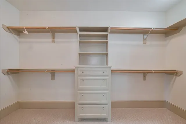 a view of an empty walk in closet