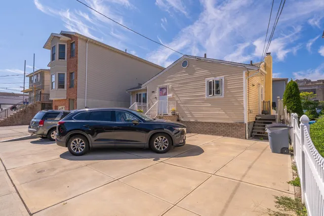 a car parked in front of a house