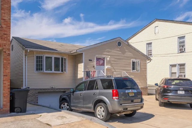 a view of a car in front of a house
