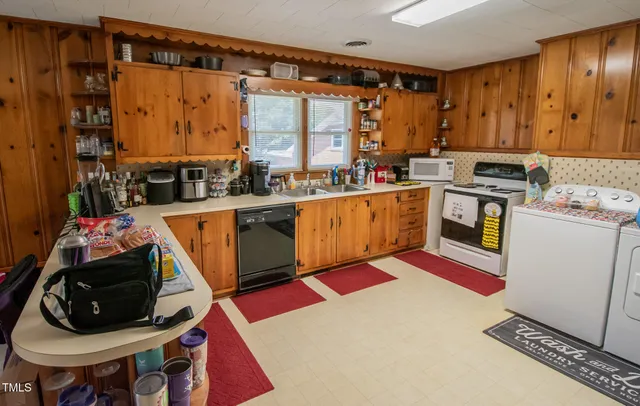 a view of an empty room with wooden walls