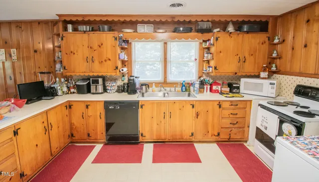 a view of an empty room with wooden walls