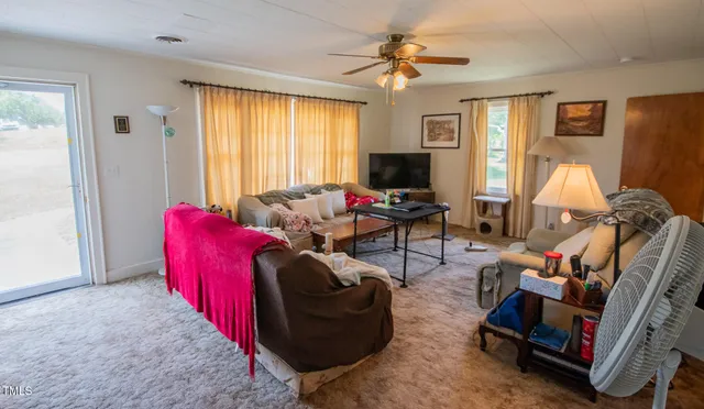 a kitchen with a refrigerator a stove top oven a sink and dishwasher