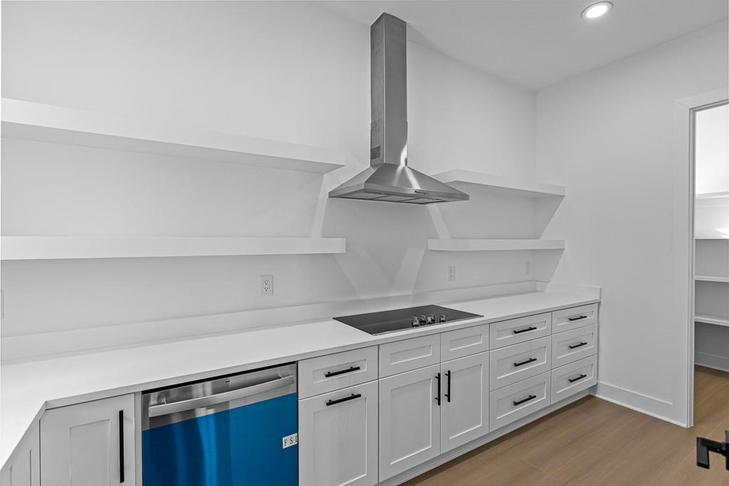 2404 Highway 124 Jefferson, GA 30549 - Photo 13 of 51 a kitchen with white cabinets and appliances