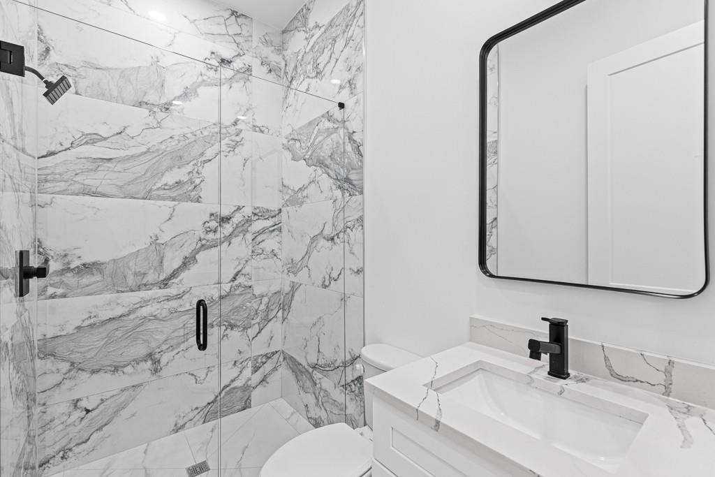 2404 Highway 124 Jefferson, GA 30549 - Photo 26 of 51 a bathroom with a sink toilet and shower