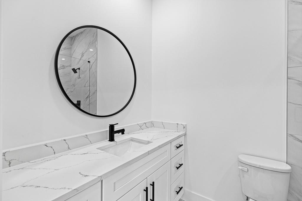 2404 Highway 124 Jefferson, GA 30549 - Photo 38 of 51 a bathroom with a sink and a mirror