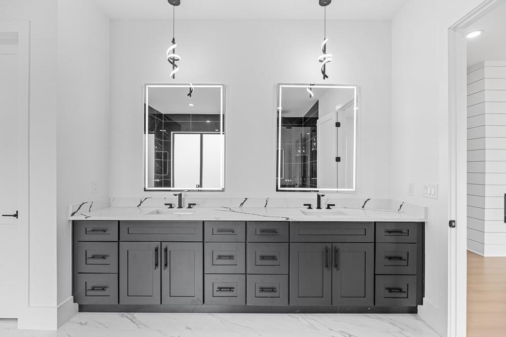 2404 Highway 124 Jefferson, GA 30549 - Photo 44 of 51 a bathroom with a double vanity sink and a mirror