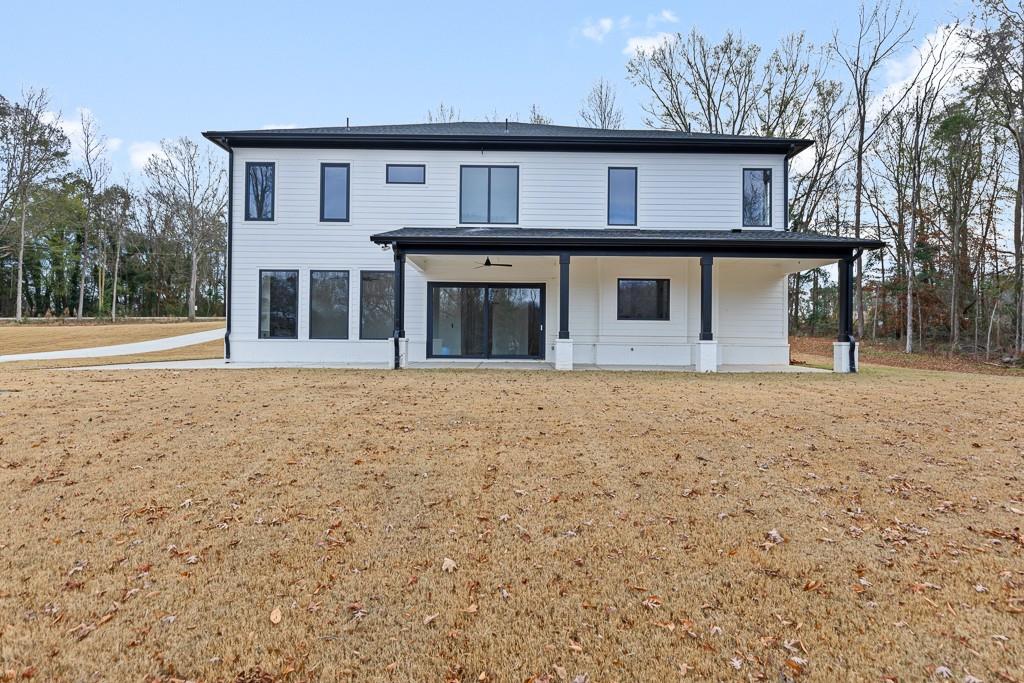 2404 Highway 124 Jefferson, GA 30549 - Photo 49 of 51 a front view of a house with large trees