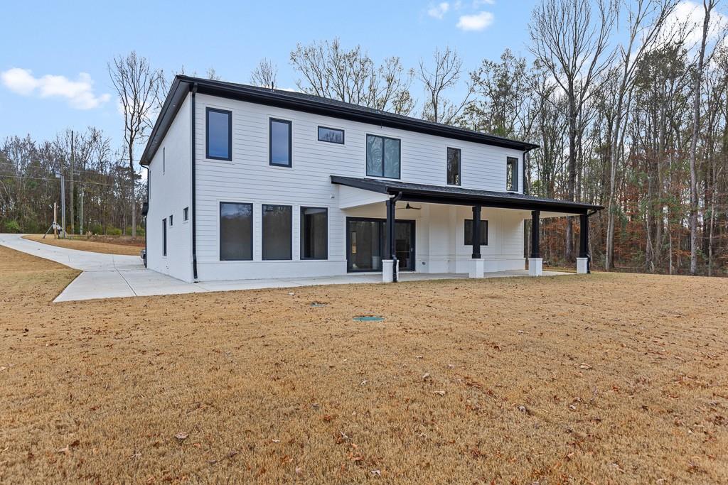 2404 Highway 124 Jefferson, GA 30549 - Photo 51 of 51 a front view of a house with a garden