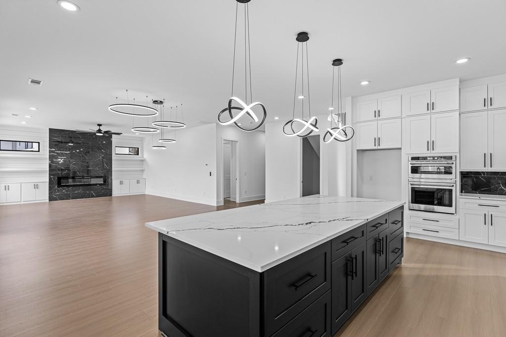 2404 Highway 124 Jefferson, GA 30549 - Photo 10 of 51 a kitchen with a stove a refrigerator a oven and a fireplace