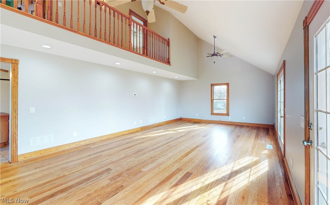2081 Stroup Road Atwater, OH 44201 - Photo 26 of 48 Unfurnished room with high vaulted ceiling, ceiling fan, and light hardwood / wood-style flooring