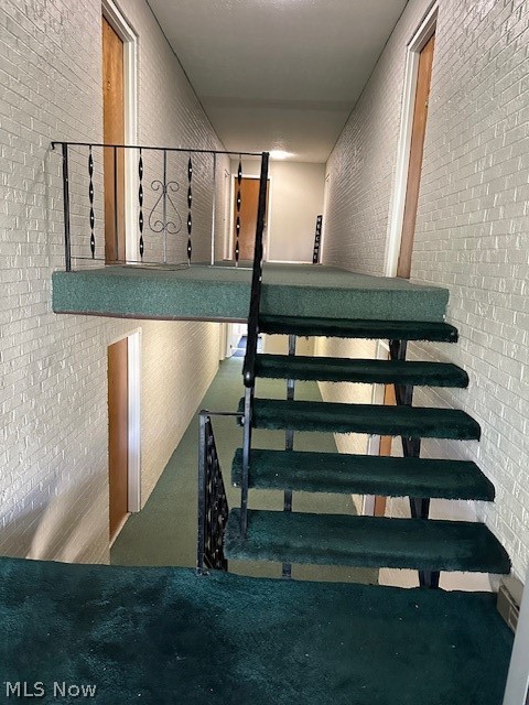4376 Darrow Road, Unit 7 Stow, OH 44224 - Photo 19 of 23 Stairway featuring brick wall and carpet floors