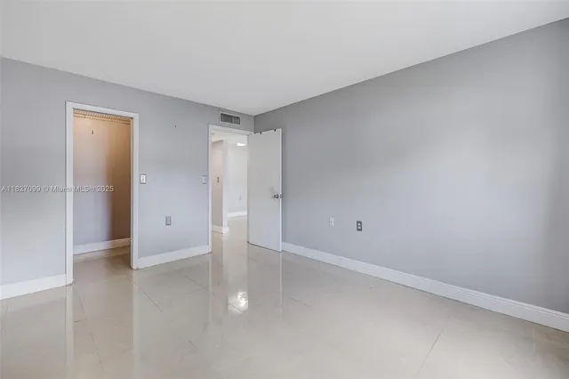 a view of a house with a backyard porch and sitting area