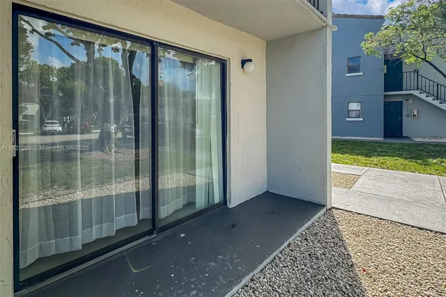 an aerial view of a houses with a lot of trees