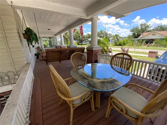 a swimming pool with outdoor seating and yard