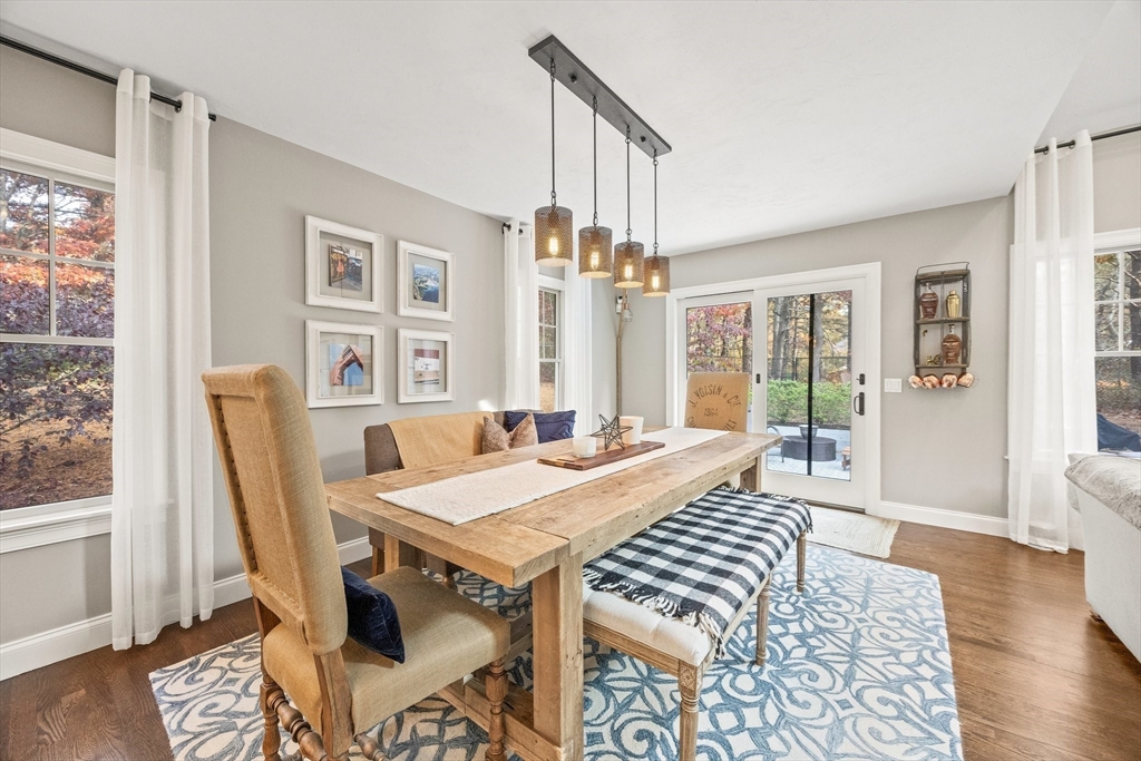 26 West Way Mashpee, MA 02649 - Photo 16 of 42 a view of a dining room with furniture window and wooden floor